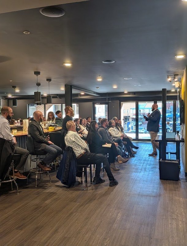 Business owners seated for a Business Boost presentation