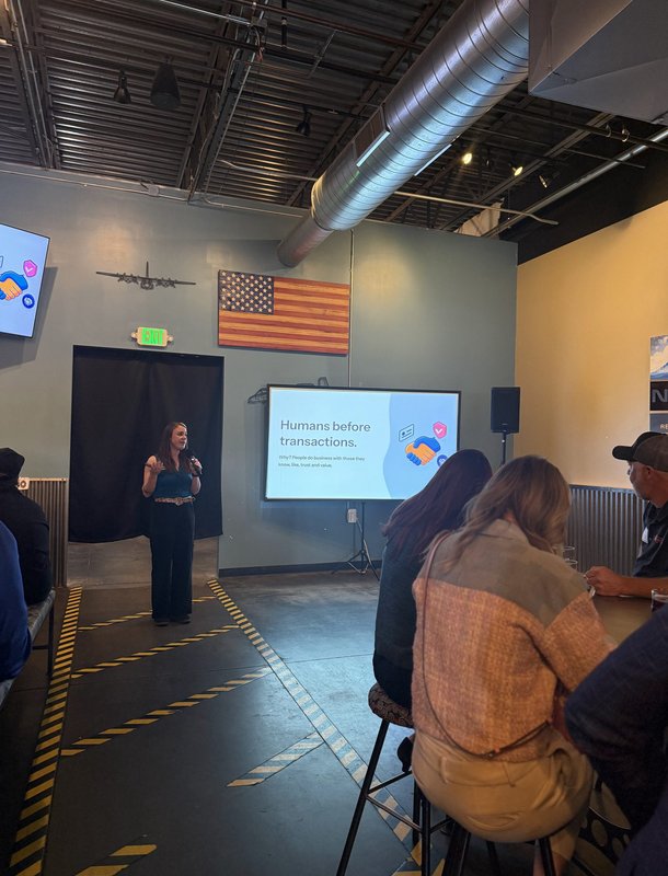 Heather Blasnek presenting a slide that reads Humans before transactions