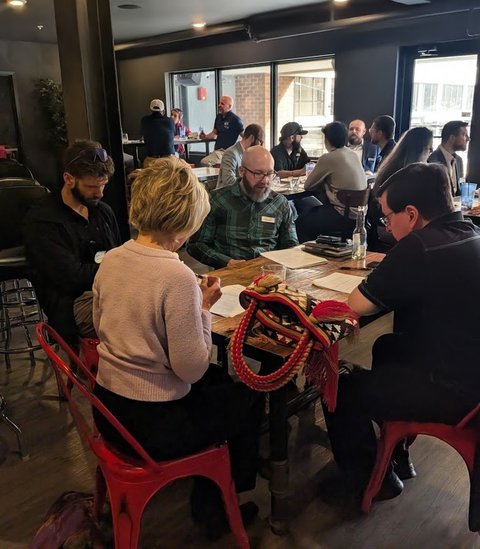 Members working through a table activity together