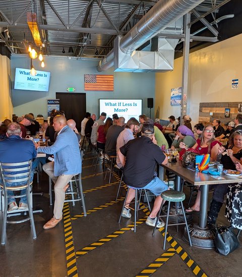 A full room at tables during Next Level Networking