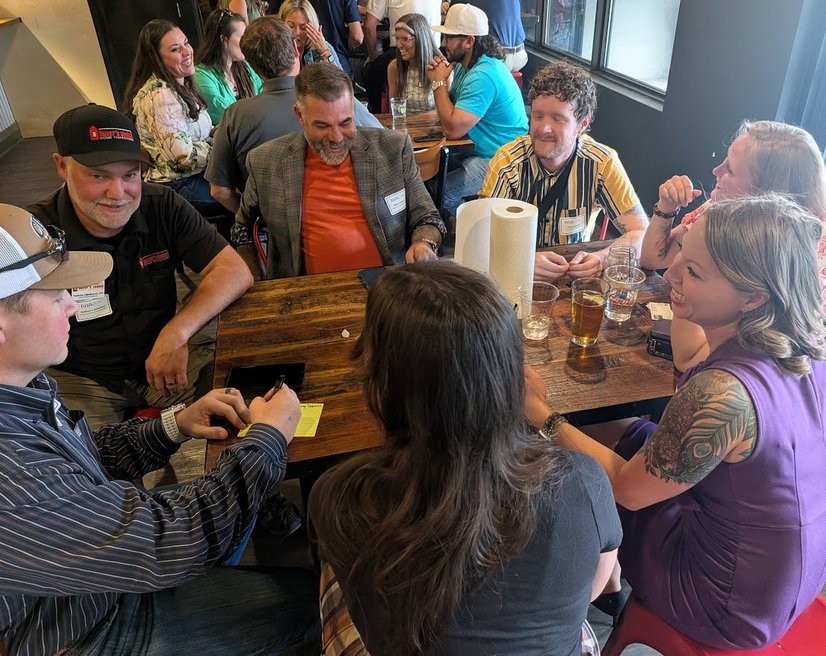 Members of the Springs Central NIA group laughing around a table