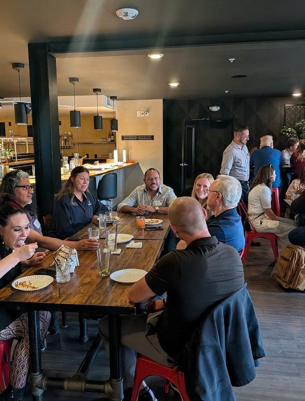 Members sharing a laugh at an NIA Colorado Springs meeting